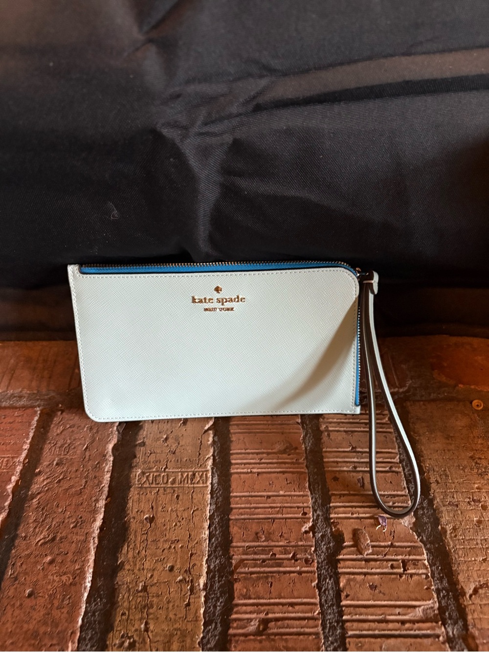 kate spade light blue and navy zip wristlet with strap